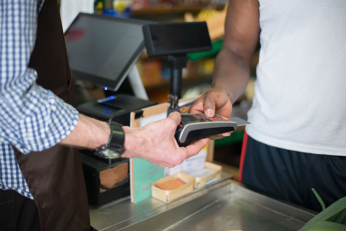 Customer paying at a shop checkout