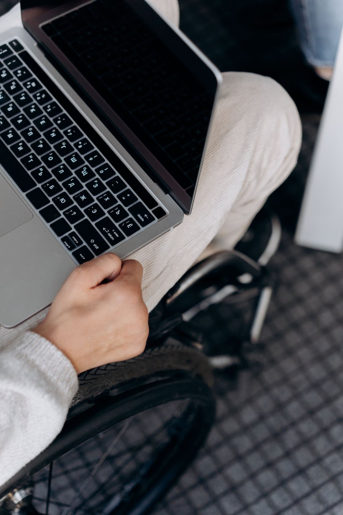 Close-up of a person working on a laptop