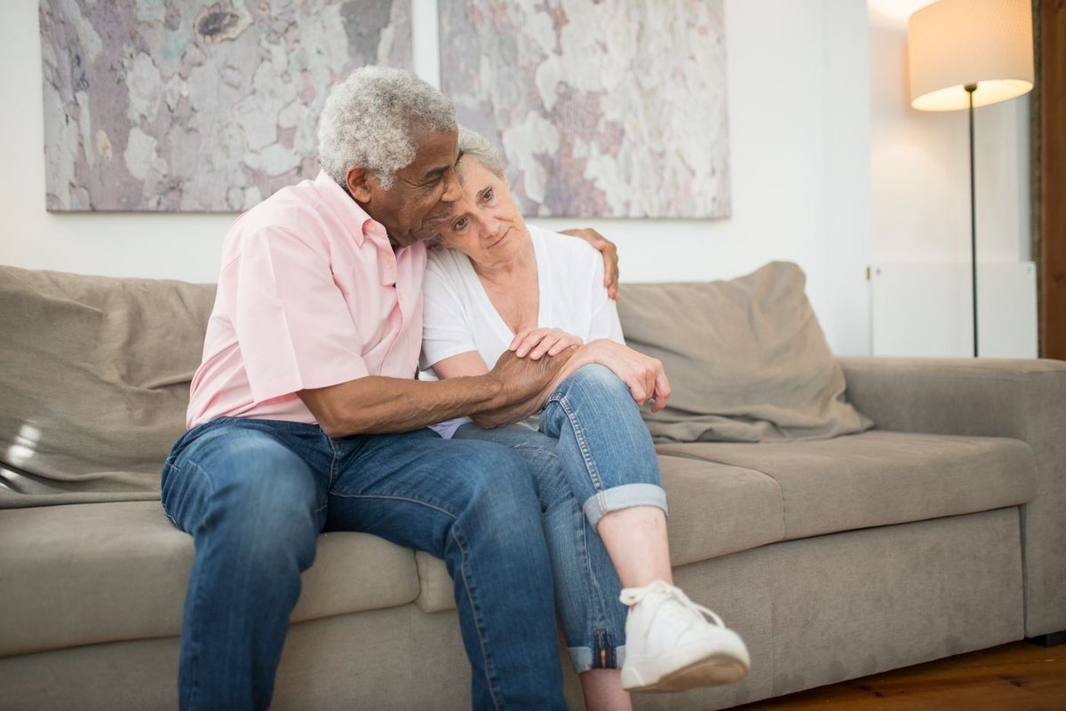 An older couple sharing a quiet moment at home
